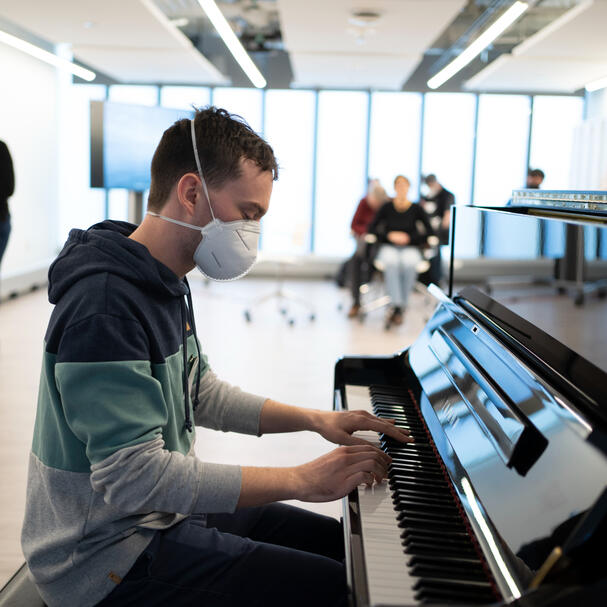 Me playing piano while wearing a mask.